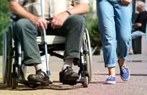 man in a wheelchair with woman