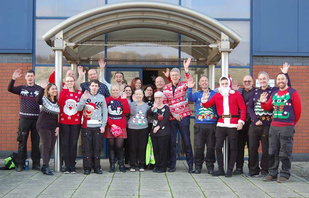 The team at Harvest Healthcare wearing Christmas Jumpers for Save the Children