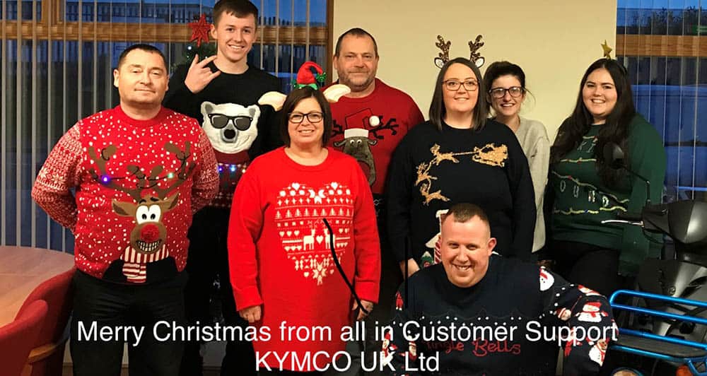 The team at Kymco Healthcare wearing their Xmas Jumpers for Save the Children
