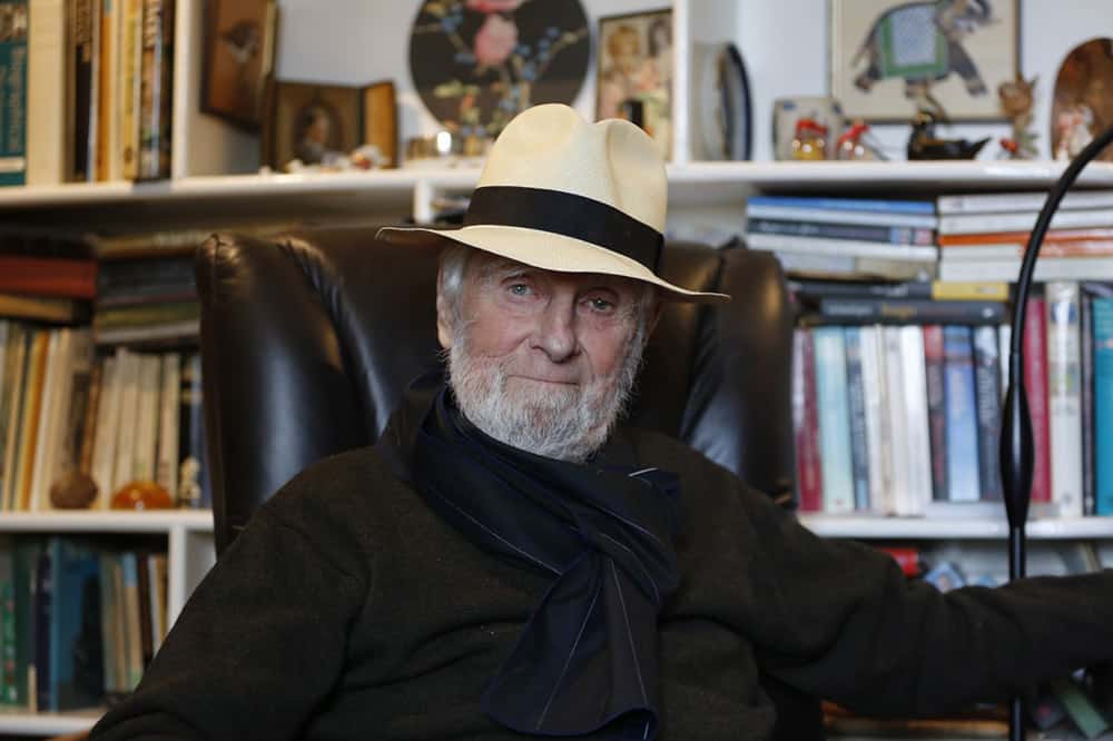 David Garman Sitting in chair with a hat