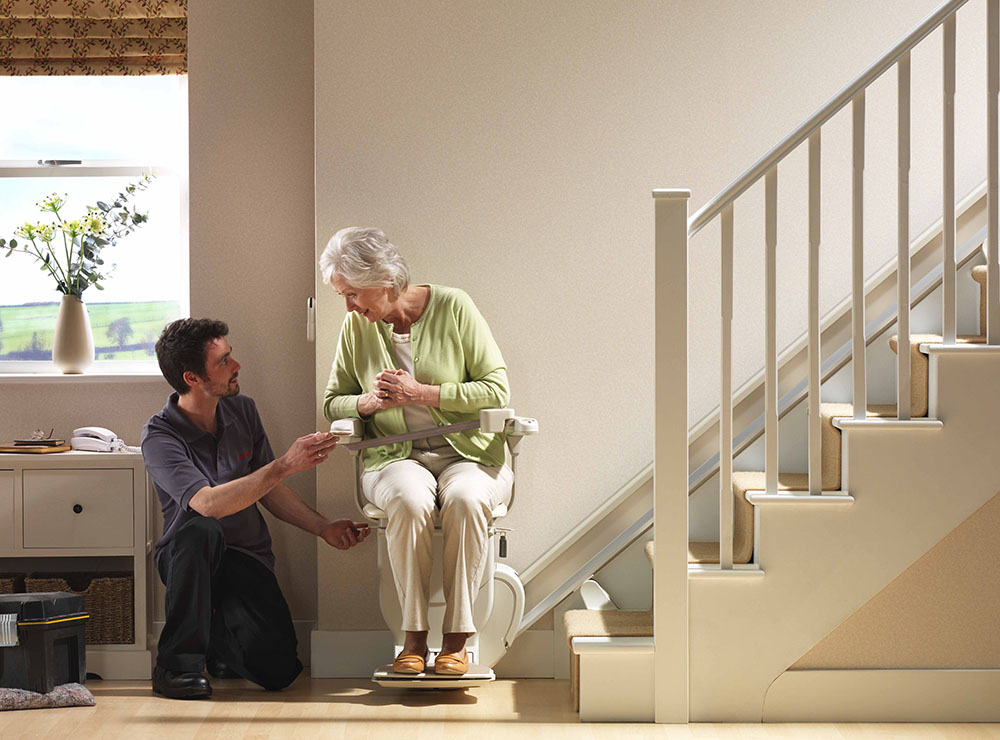 Stanah stairlift being used by woman in the home
