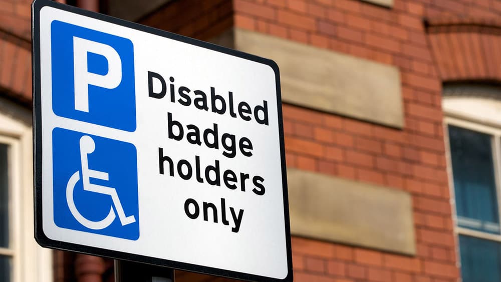 Blue Badge Only parking sign as hidden disabilities now part of scheme