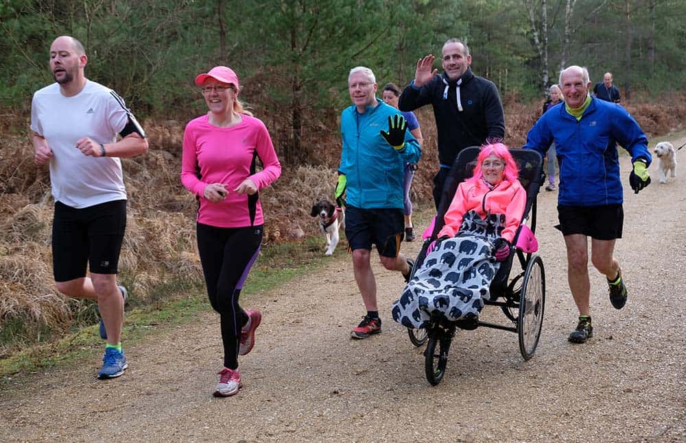 Glenys Waters taking part in a park run with her colourful wig