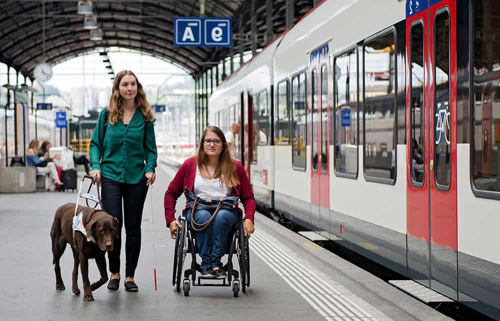 Wheelchair user at railway station image