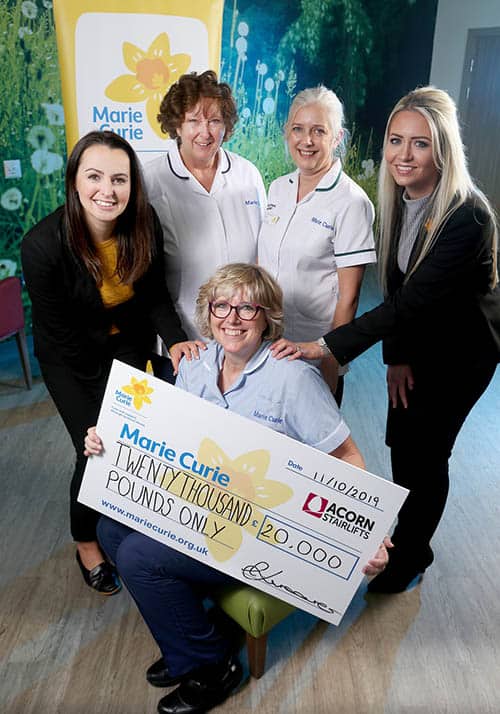 Acorn Stairlifts celebrate after raising £20,000 for Marie Curie