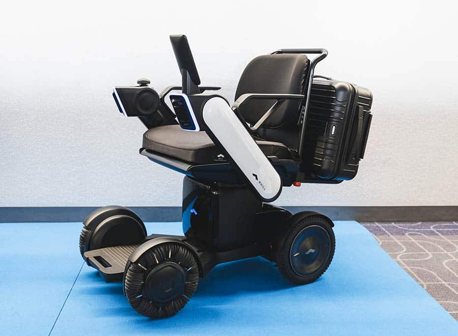 WHILL Haneda Trial model with luggage