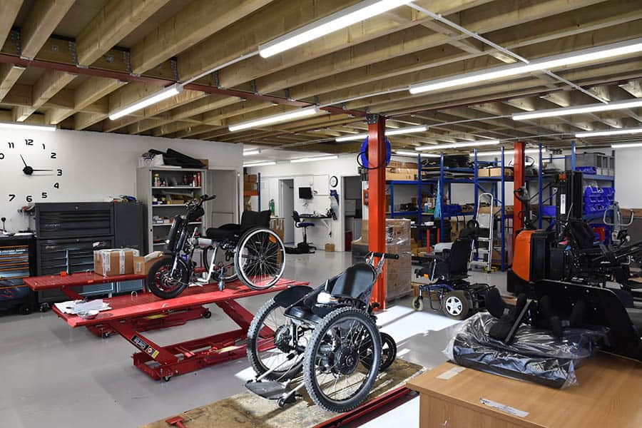 Recare new workshop with custom wheelchairs