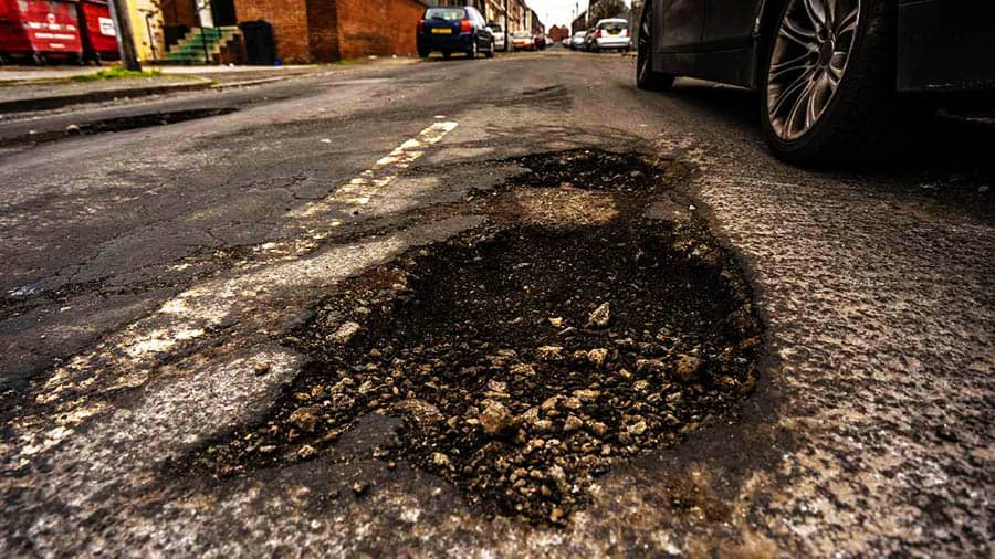 Pothole in road mobility