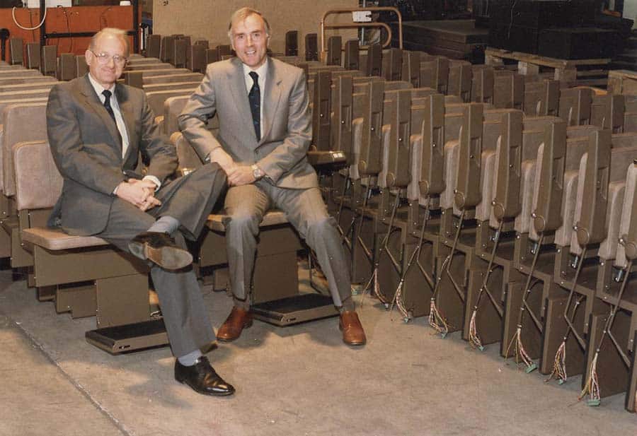 Brian and Alan Stannah with their stairlift ranges earlier in their careers