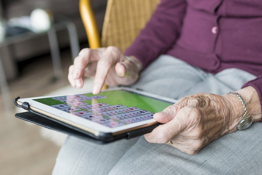 elderly woman using tech image