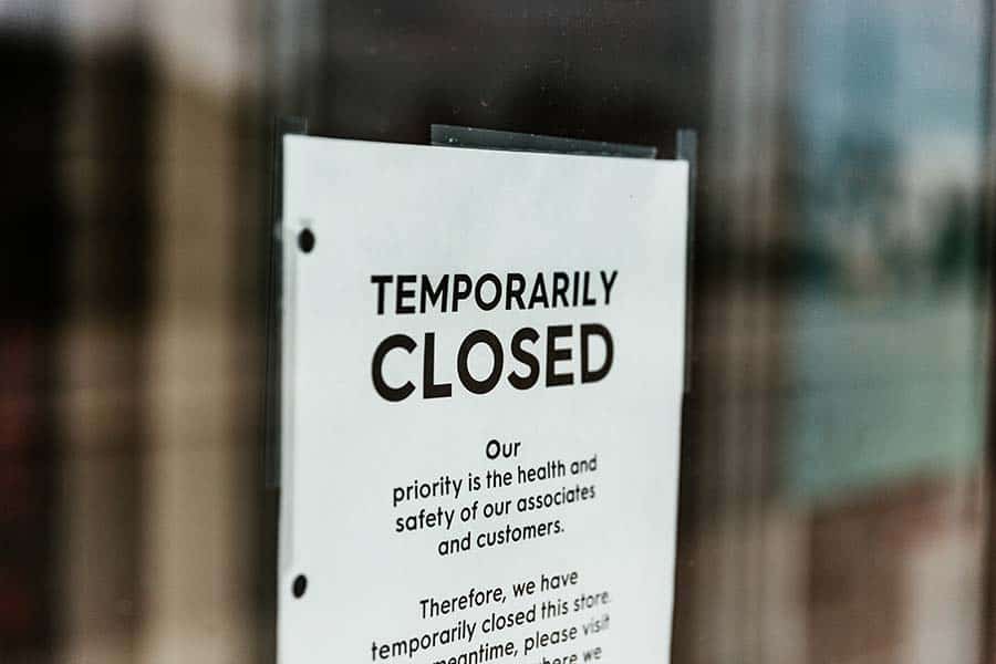 temporarily closed sign on shop door