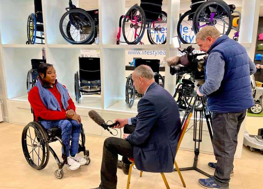 An ITV news crew interviewing the paralympian Anne Wafula Strike MBE at Lifestyle and Mobility’s Harlow store