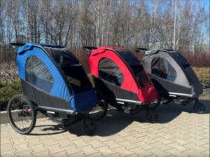 3 Baffin YOGI strollers in blue, red and black.