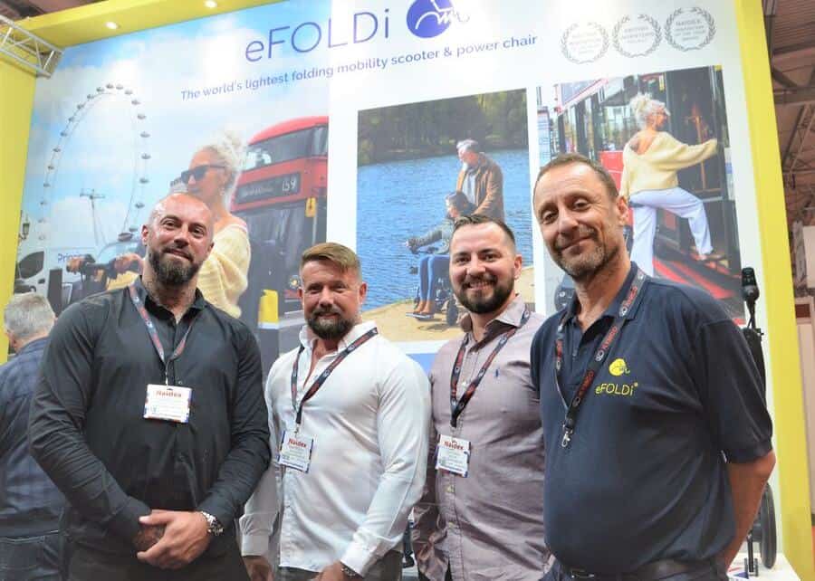Group shot_NAIDEX 22_Tim Ross from eFOLDi with Dom Goldsmith and associates from Freedom Mobility