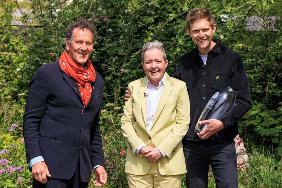 Charlotte Harris and Hugo Bugg receive the award from BBC's Gardener;s World presenter Monty Don for 'Best Show Garden' 