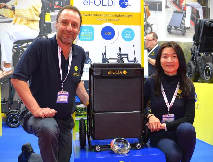 Sumi Wang, CEO + Tim Ross, National Sales Manager from eFOLDi with Naidex Award & Lite Scooter